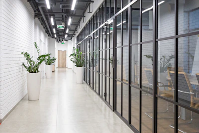 Wide shot of a clean, newly built partition wall in a bright office space
