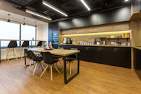 black and brown wooden table and chairs