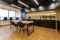 black and brown wooden table and chairs