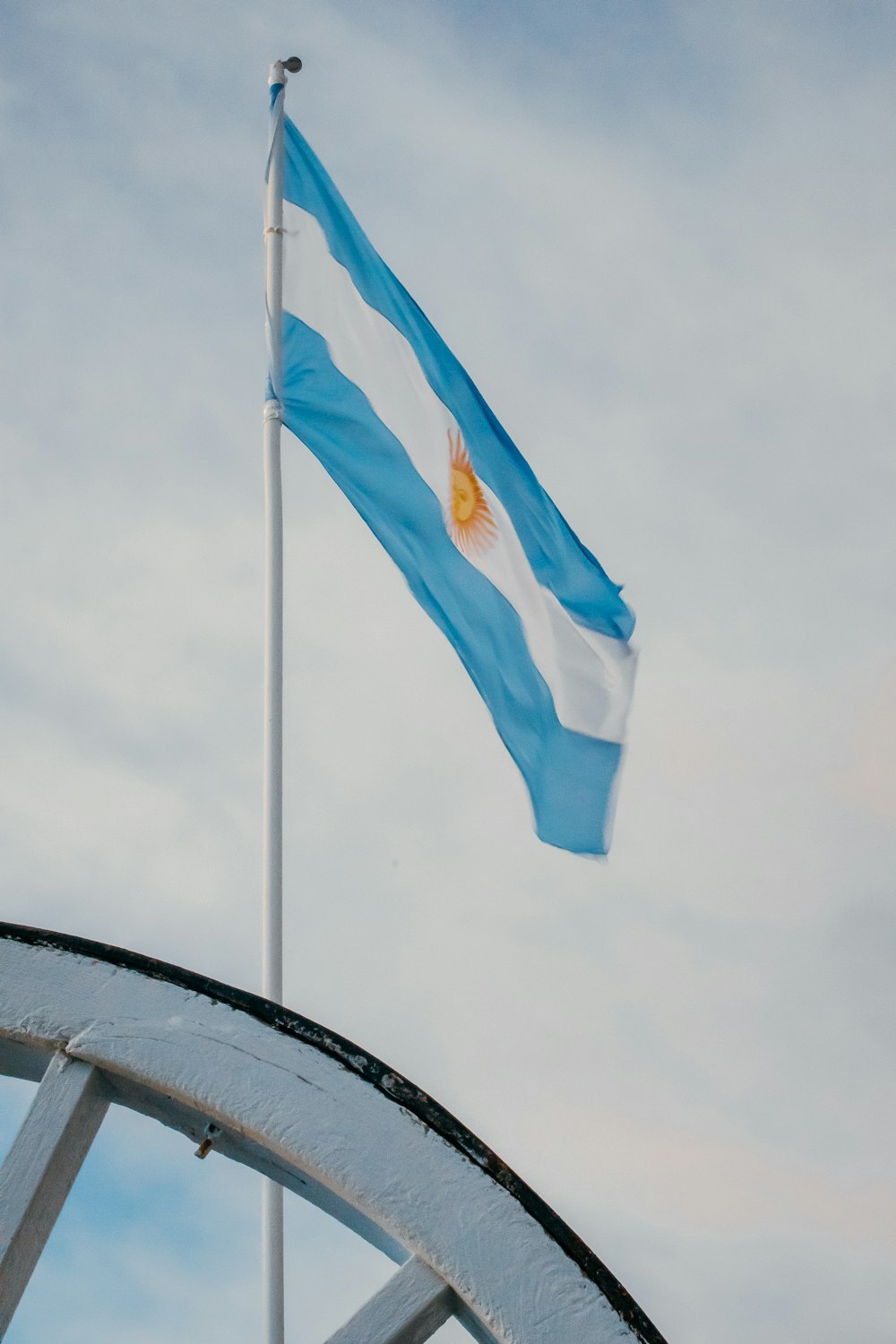 blue and yellow flag on pole