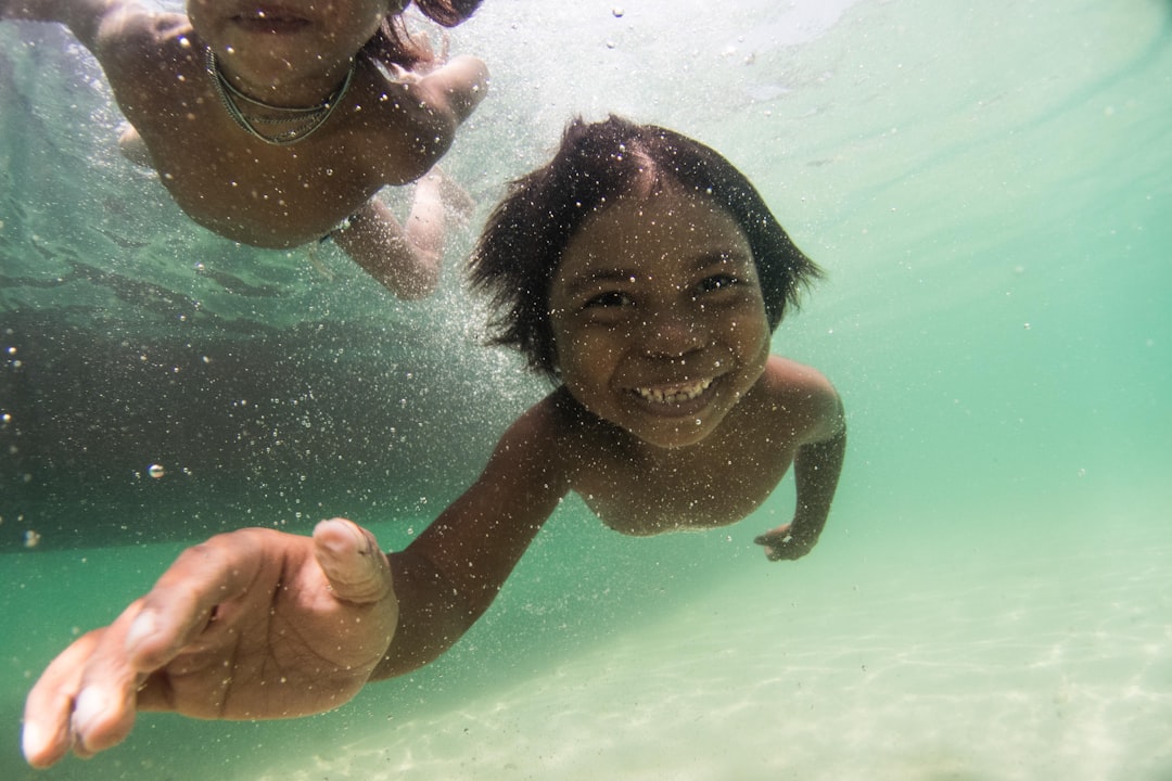 girl in swimming pool smiling