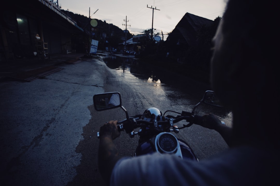 motorcycle parked on side of road during daytime