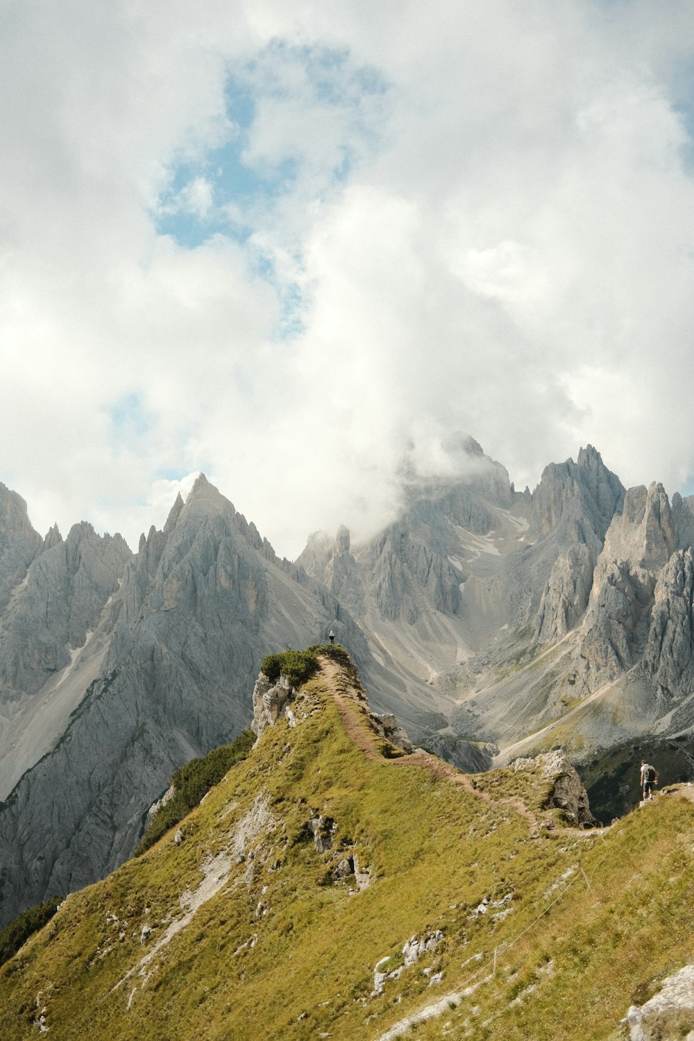 a group of people hiking up the side of a mountain