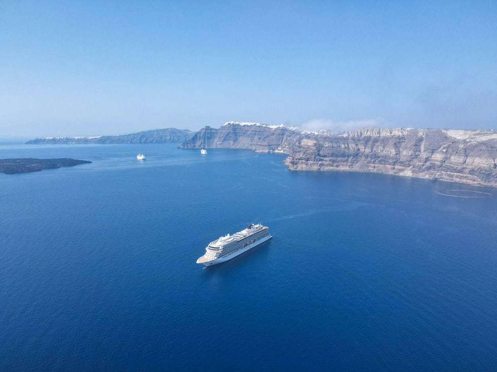 white and black boat on sea during daytime