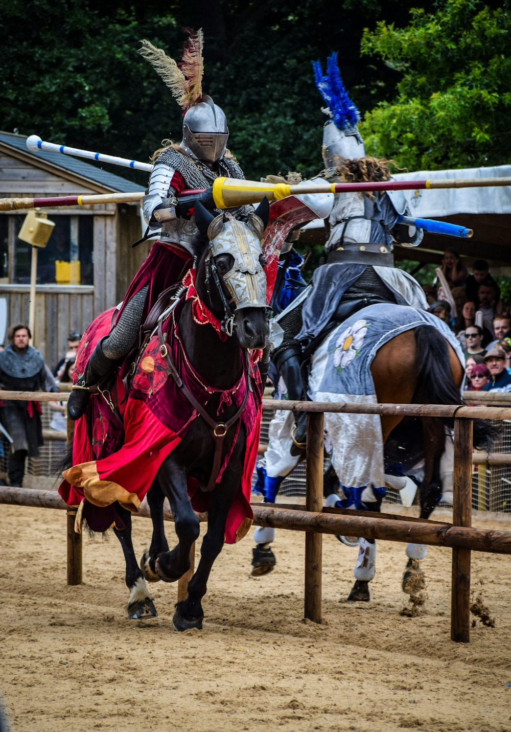 a man in armor riding on the back of a horse