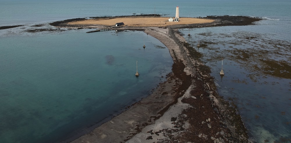 body of water near white building during daytime