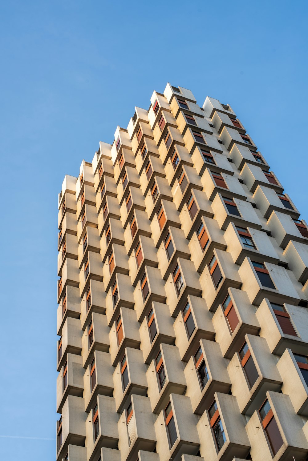 white concrete building under blue sky during daytime