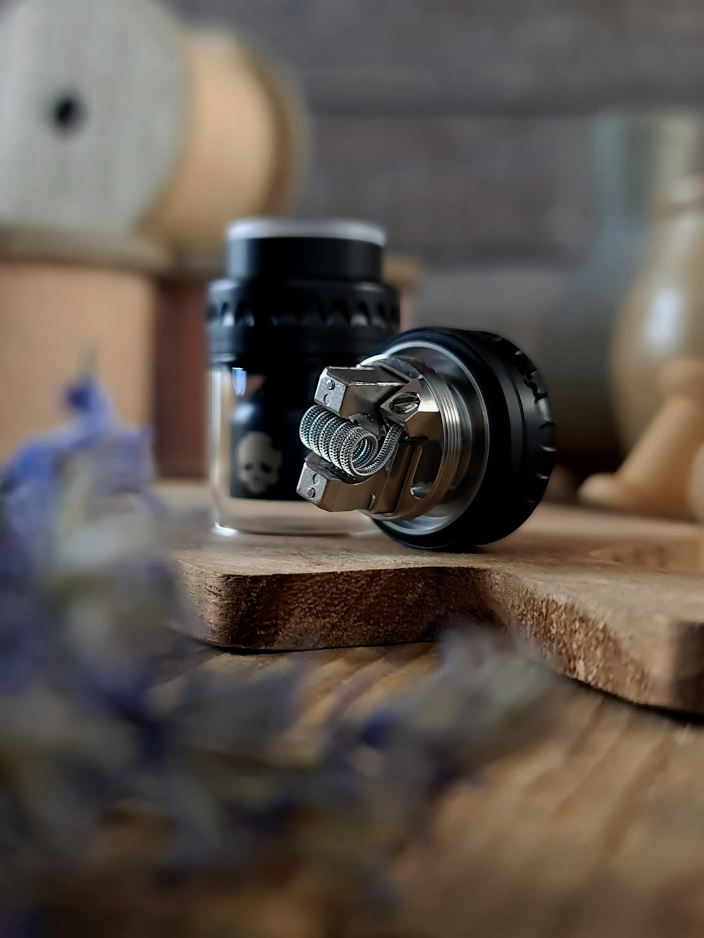 black and silver camera lens on brown wooden table