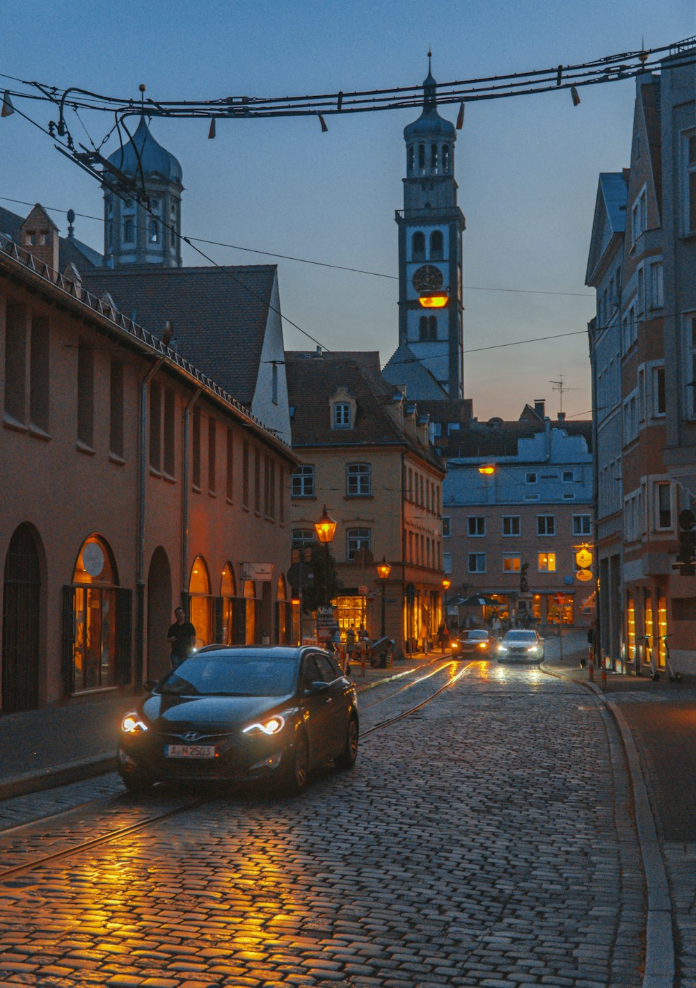 cars parked on side of the road during night time