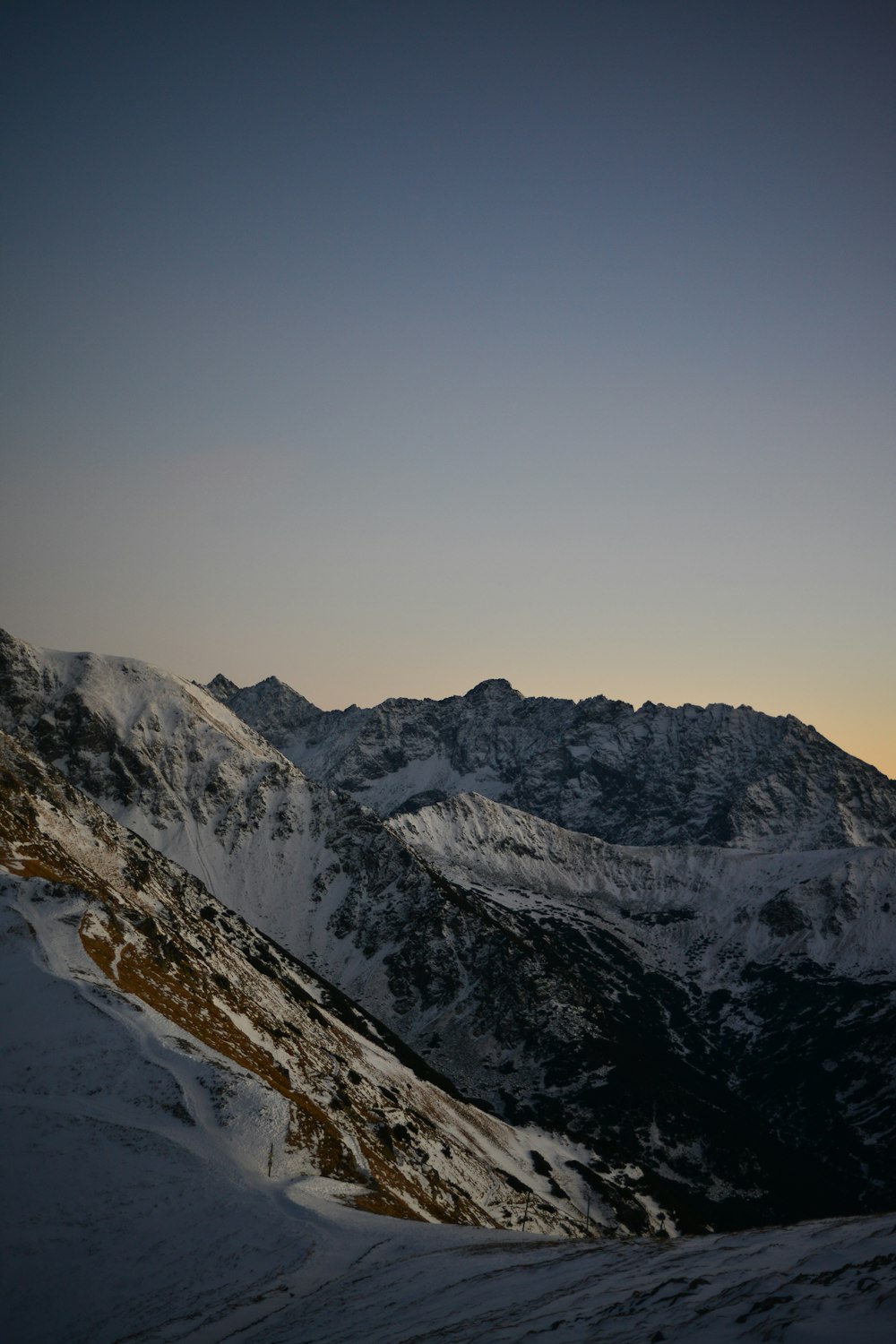 snow covered mountain during daytime