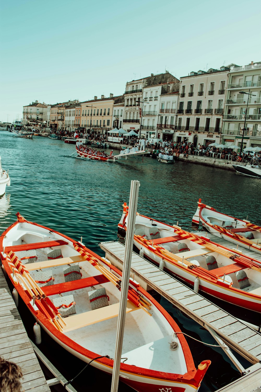 white and red boat on water during daytime