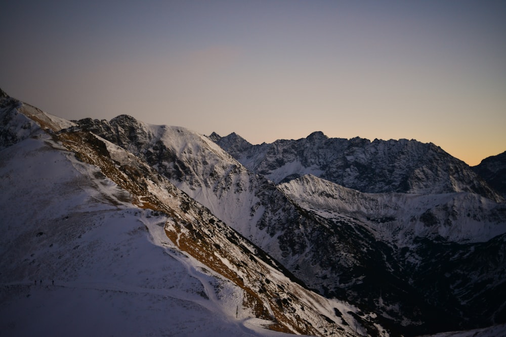 snow covered mountain during daytime