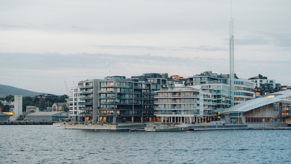 city buildings near body of water during daytime