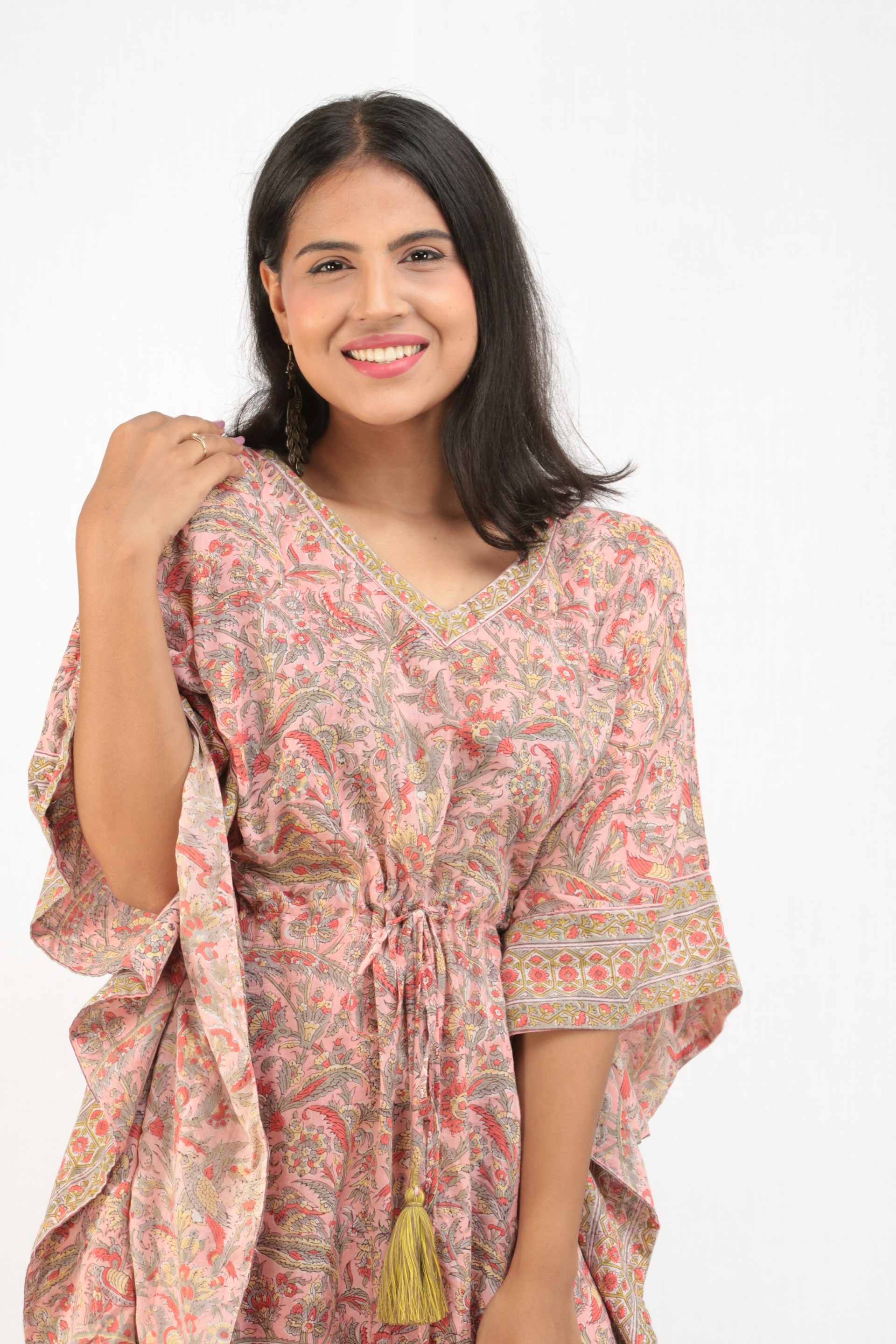 woman wearing yellow long-sleeved dress under white clouds and blue sky during daytime