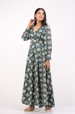 A stylish woman wearing a comfortable earth-toned oneset, smiling confidently.