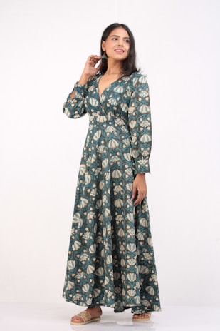 A stylish woman wearing a comfortable earth-toned oneset, smiling confidently.