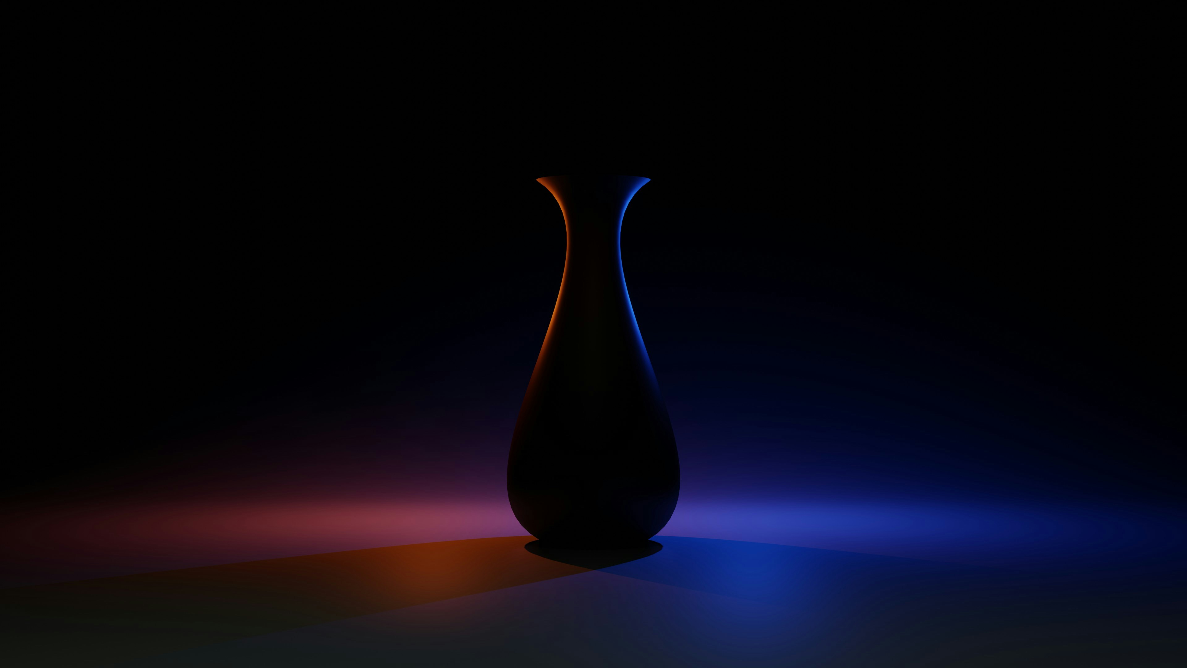 blue ceramic vase on brown wooden table