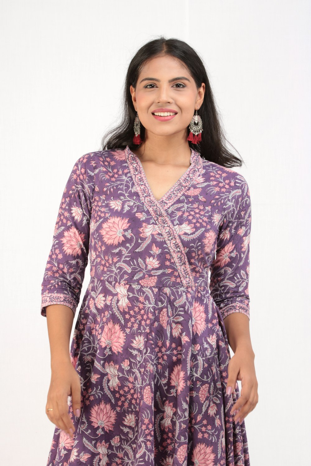 woman in purple and white floral long sleeve shirt