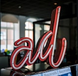 red and white love neon light signage