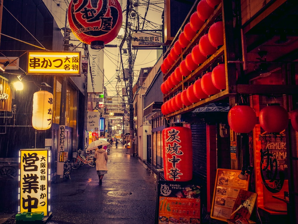 red chinese lanterns on street during daytime