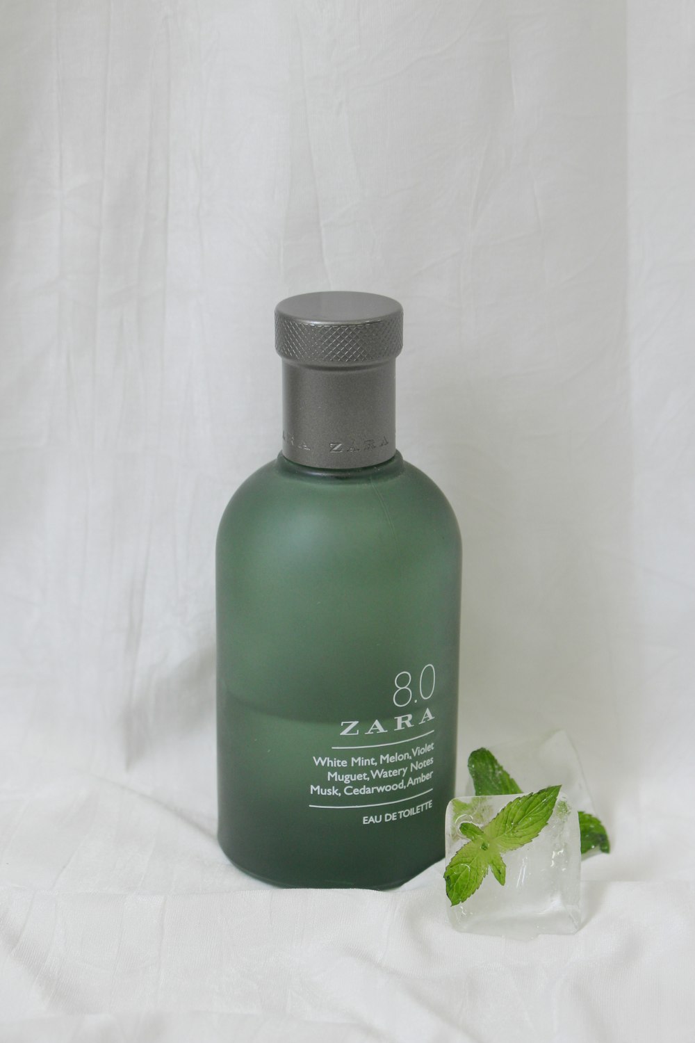 green and black plastic bottle photo – Free Zara Image on Unsplash