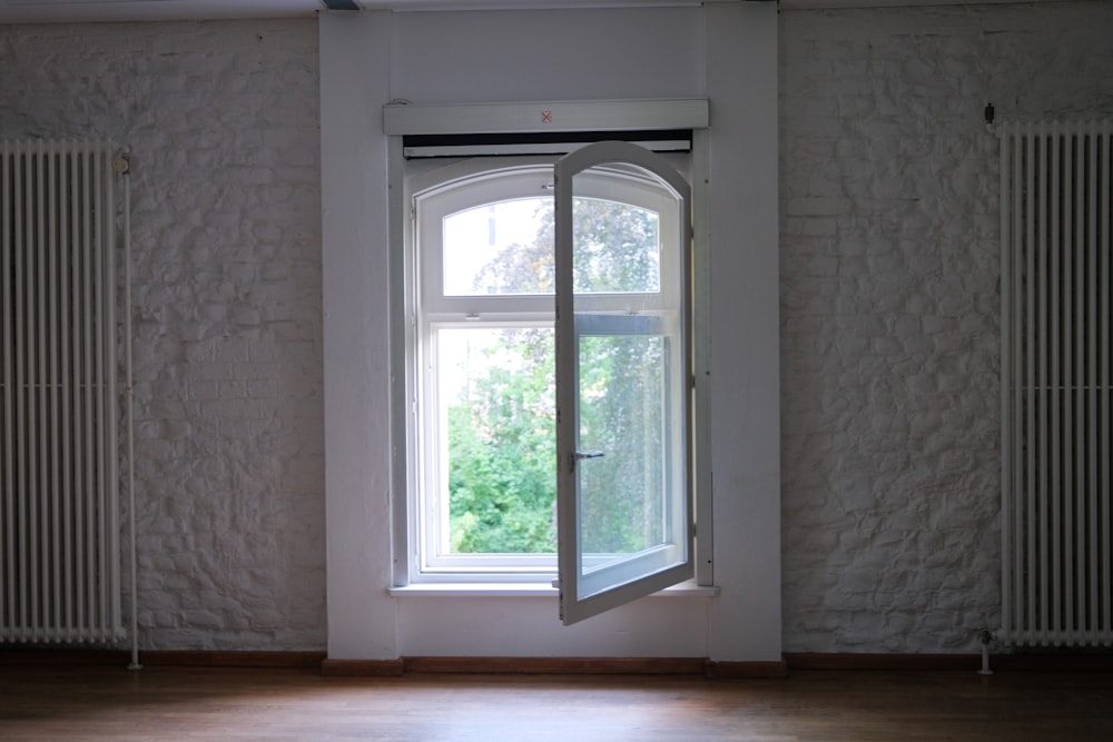 white wooden framed glass window