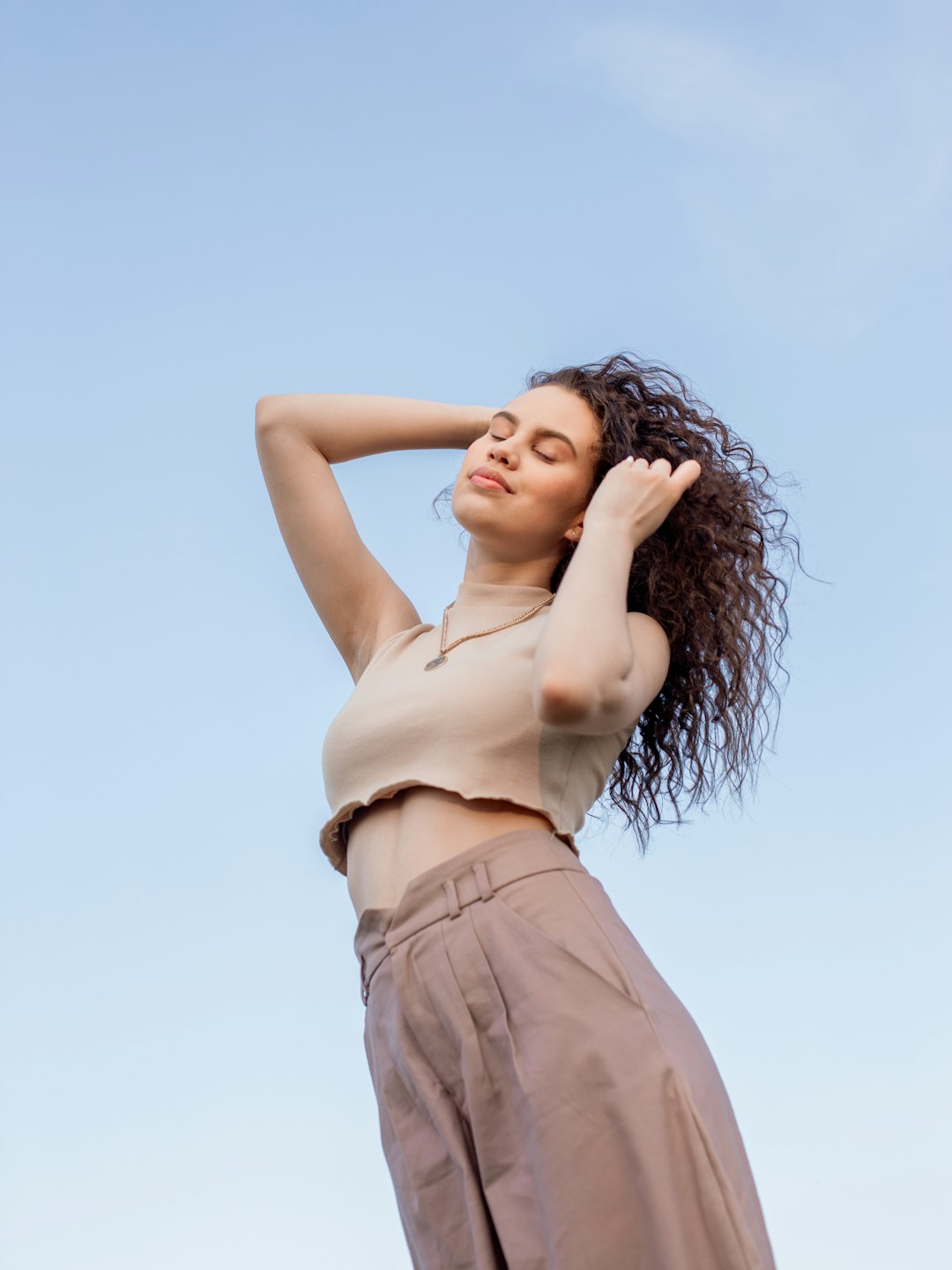 woman in brown sleeveless dress