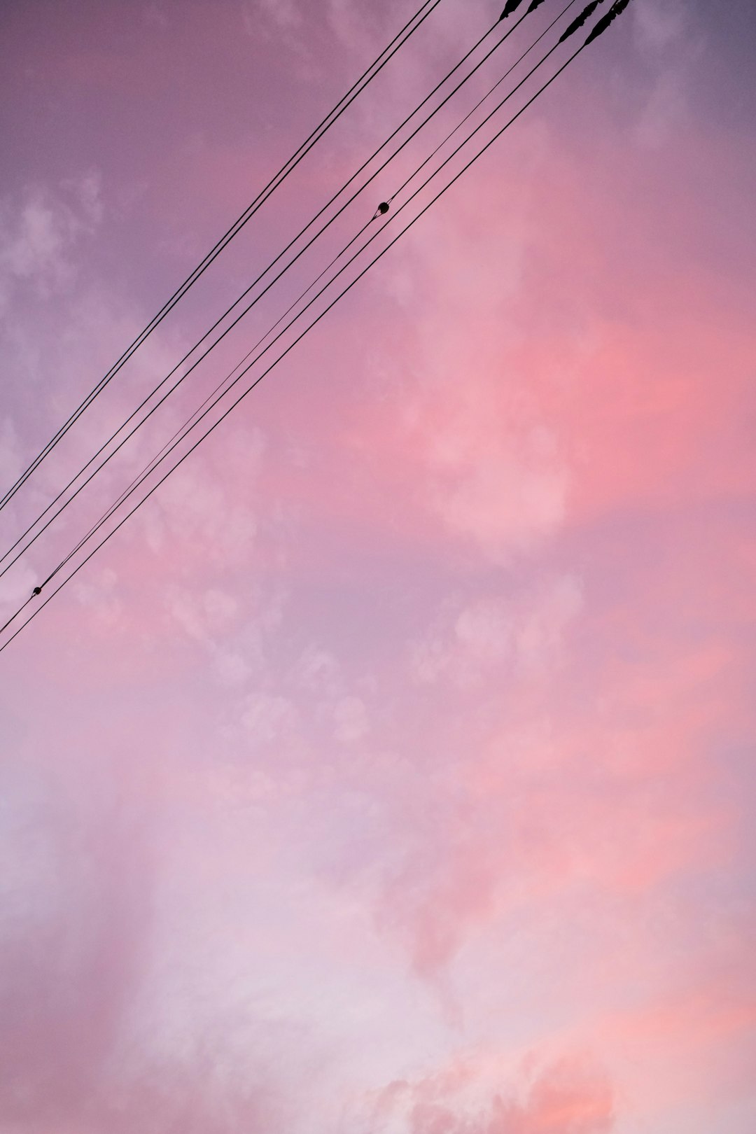 black electric wires under cloudy sky