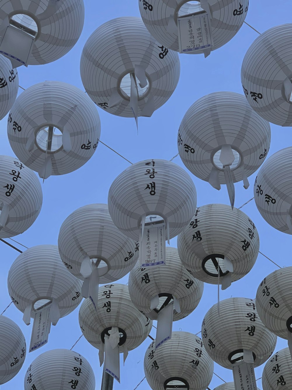 white paper lantern lot during daytime