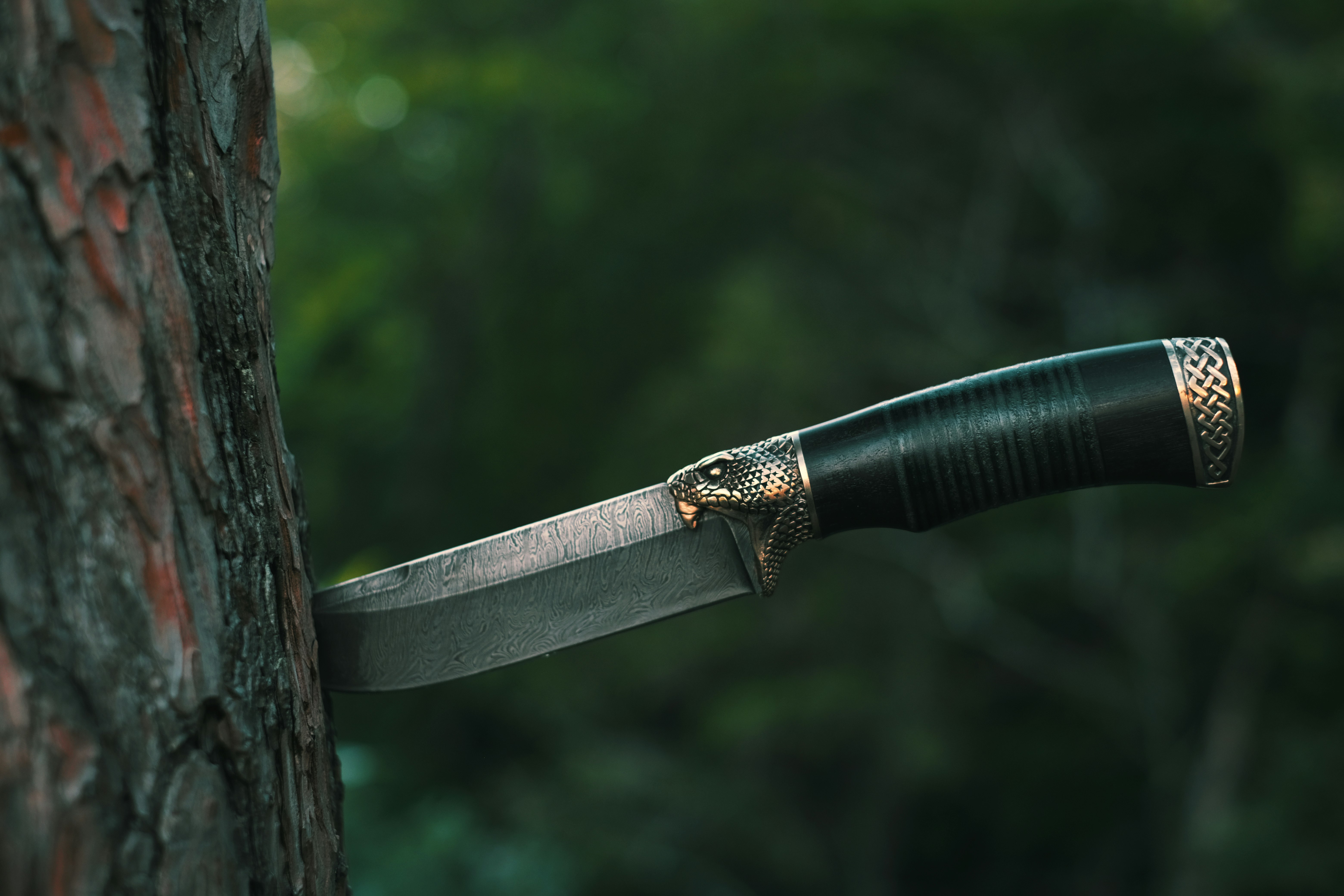 black and silver knife on brown wooden surface