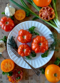 sliced orange fruit on white ceramic plate