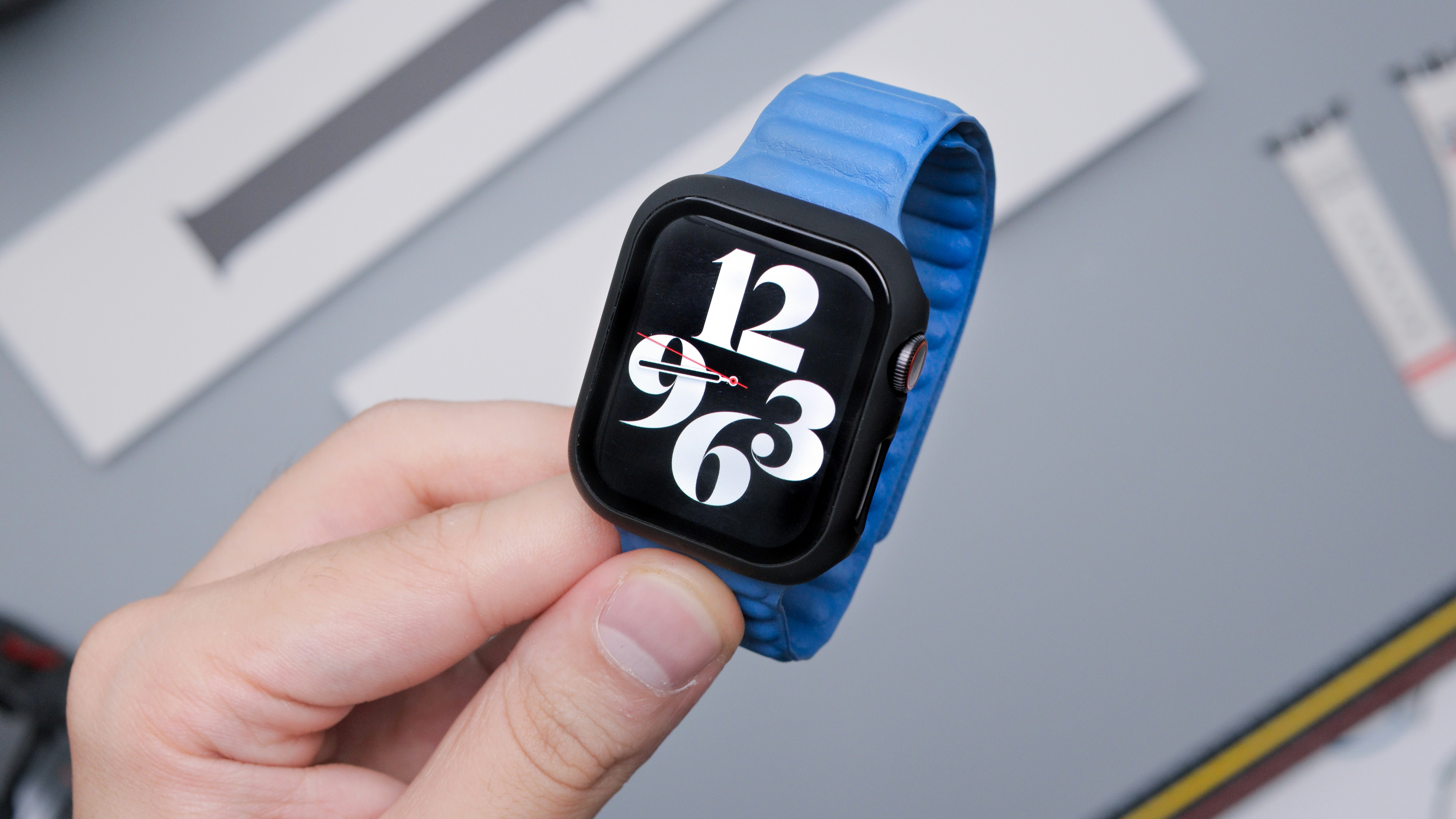 blue and black mickey mouse print smart watch, Checking Time on Apple Watch with a Case and Blue Band