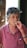 woman in pink button up shirt smoking