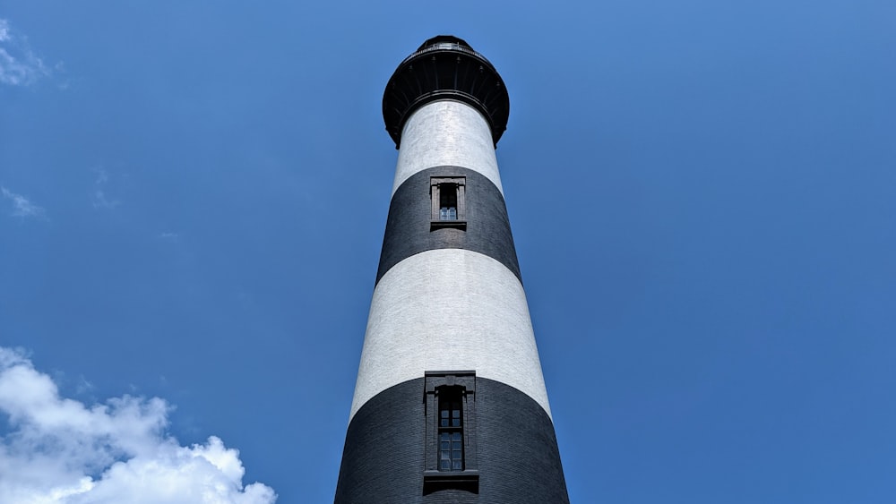 black and white lighthouse under blue sky during daytime