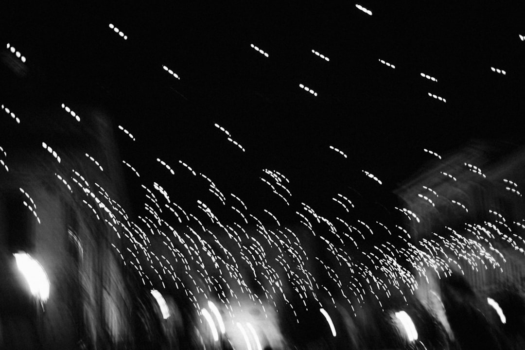 water droplets on glass window during night time