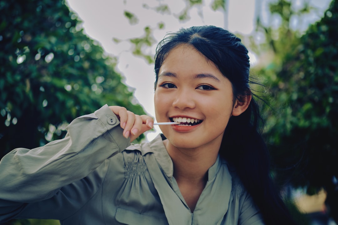 woman in gray jacket smiling