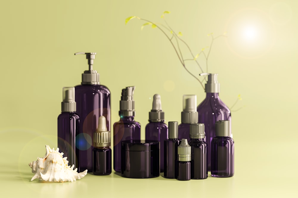 black and purple bottles on white surface