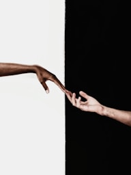 persons feet on white wall