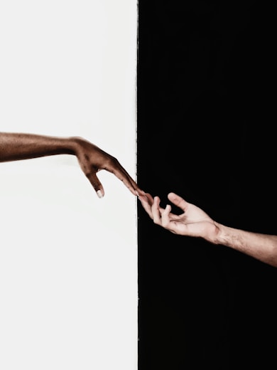 persons feet on white wall