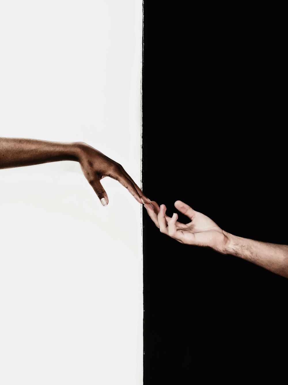 persons feet on white wall