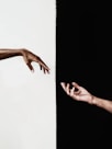 persons hand on white surface