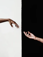 persons hand on white surface