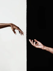 persons hand on white surface