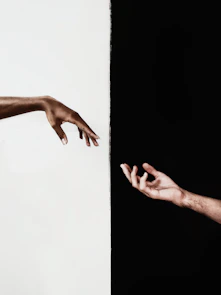 persons hand on white surface