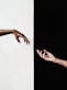 persons hand on white surface