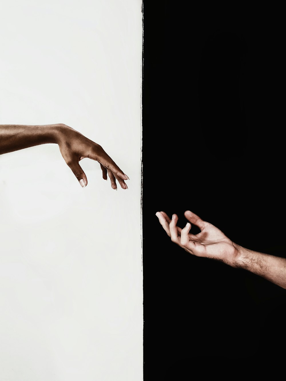 persons hand on white surface