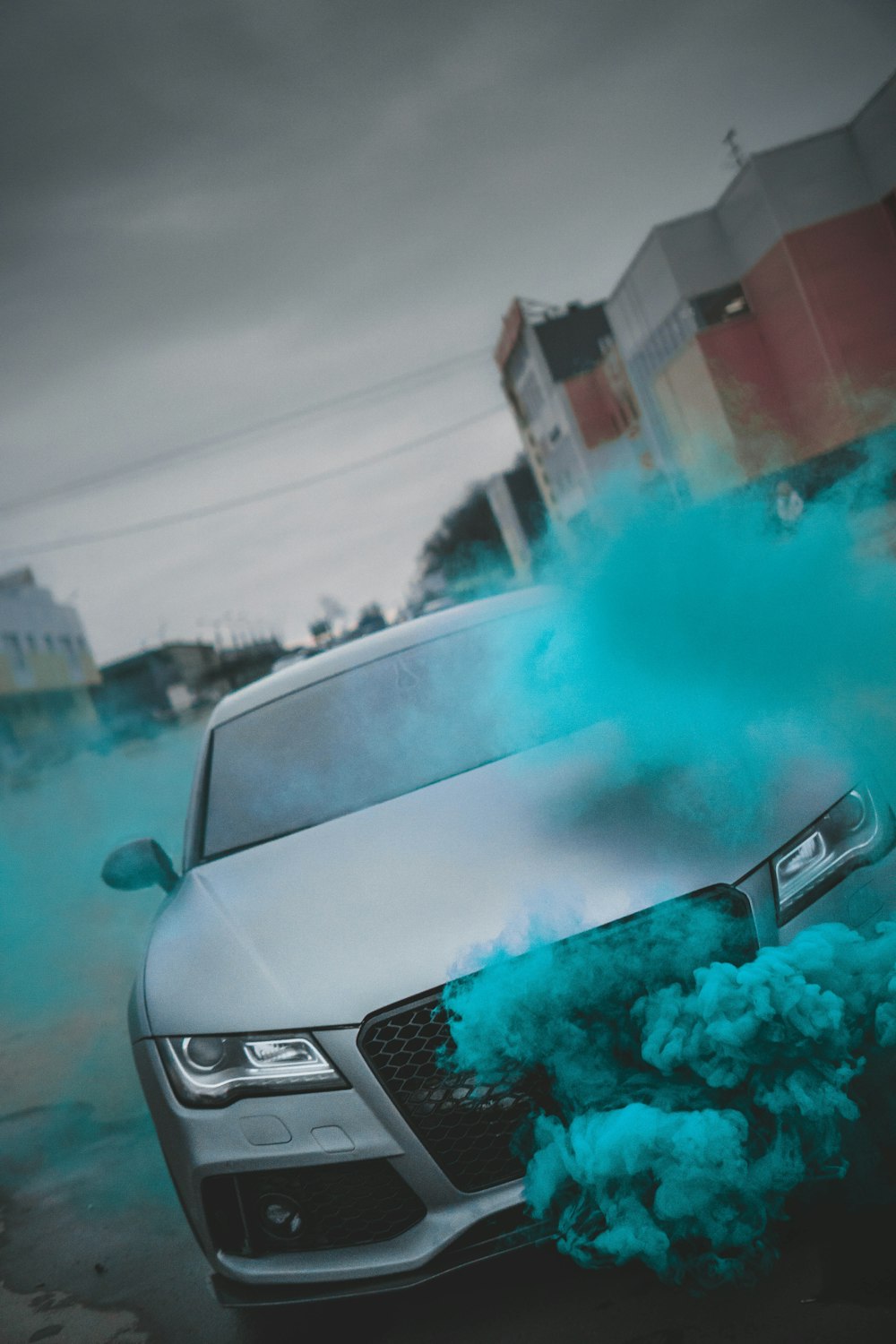 silver mercedes benz car with blue powder on hood