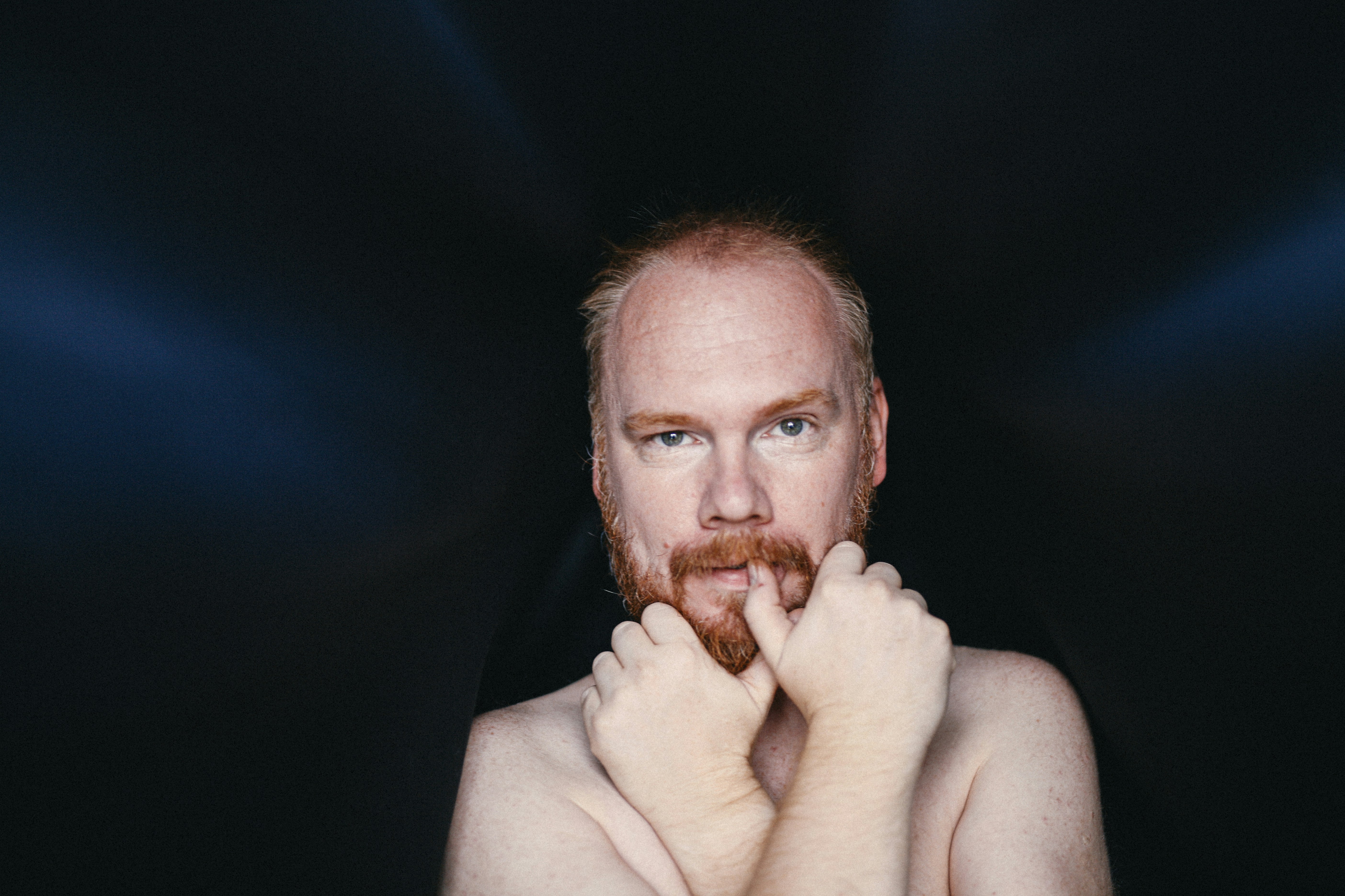 topless man with tongue out