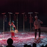 A young woman balancing multiple spinning plates, showcasing extraordinary coordination.