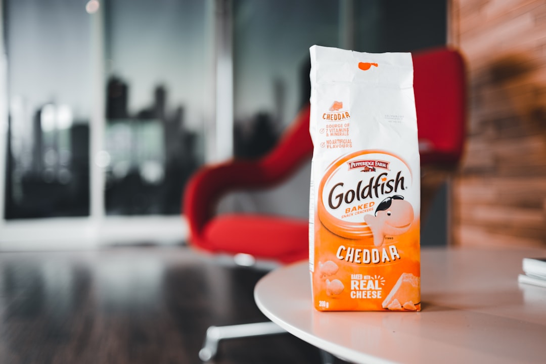 orange and white plastic pack on white table